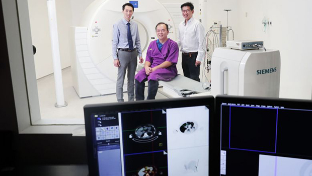  ​(From far left) Adjunct Assistant Professor Troy Puar, hypertension patient Lim In Chong and Professor Roger Foo at the Clinical Imaging Research Centre at the National University of Singapore's Yong Loo Lin School of Medicine. ST PHOTO KELVIN CHNG